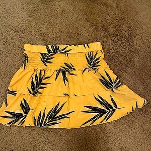 large yellow skirt with green palm leaves